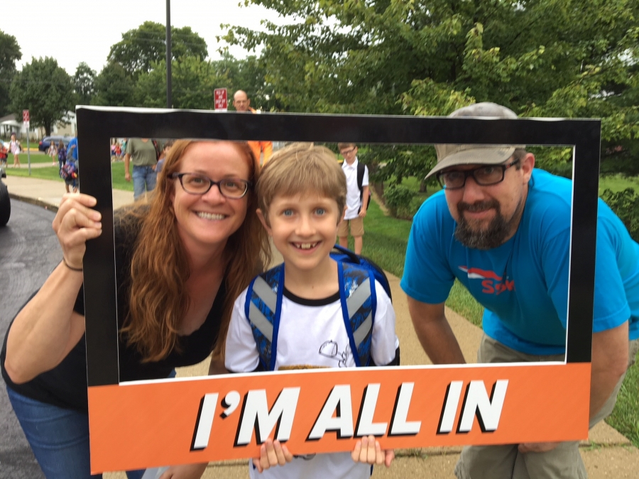 people holding a frame sign